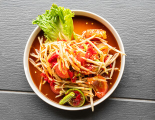 Papaya salad with fermented fish, spicy food asian thailand, fusion cuisine som tum traditional  herb cook.