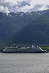 Modern cruiseship or cruise ship liner Solstice, Eclipse or Equinox departure sail away from...