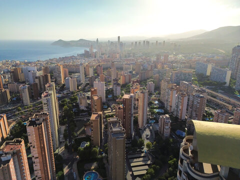 Aerial cityscape of Benidorm with skyscrapers and Mediterranean beach