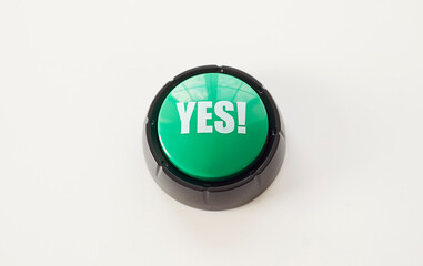 Yes text on green round button, top view of circle key to press with finger and choose positive...