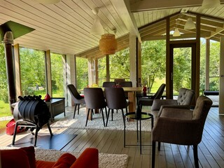 Modern and stylish interior of a country house on a summer day. High quality photo