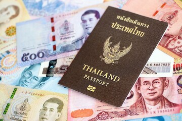 Thai baht currency money bills and passport. The concept of travel and vacation