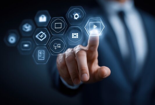 Man in suit touching futuristic digital interface with glowing hexagonal icons, representing connection and advanced technology in a modern, dark ambiance