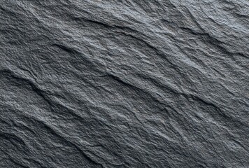Textured slate surface, dark gray with diagonal ridges