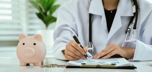 A doctor inspects finances with health concepts, linking insurance, savings, investment, and...