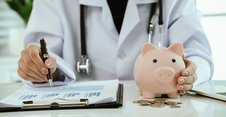 A doctor inspects finances with health concepts, linking insurance, savings, investment, and...