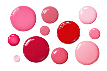 A variety of glossy, rounded shapes in shades of pink and red
