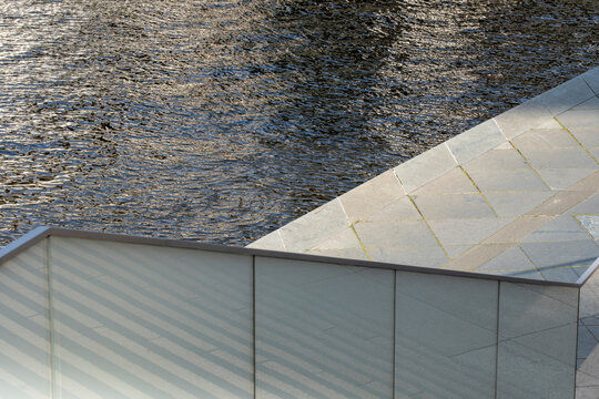 Glass facade and water reflection in abstract architectural detail, symbolizing modern background, minimal design, contemporary texture and geometric urban clarity