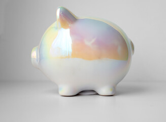 Charming Piggy bank on a light background - Savings and financial planning