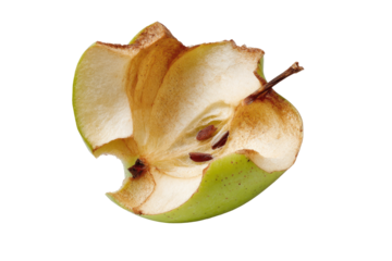 Half-eaten green apple, showing decaying flesh
