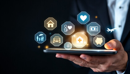Close-up of businessman holding tablet with floating insurance icons.