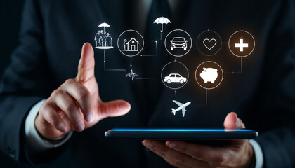 Close-up of businessman holding tablet with floating insurance icons.
