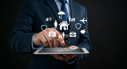 Close-up of businessman holding tablet with floating insurance icons.