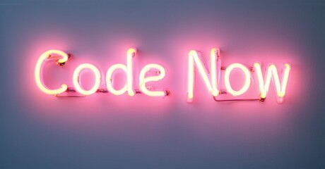 Bright pink neon sign displays words Code Now. Background is blurred purple, black gradient. Simple, motivational message.