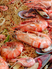 Cooked Shrimp and mussels with pasta sold at the fish market in Bergen