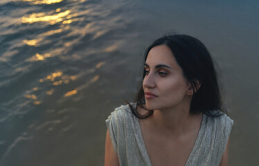 Portrait of a pensive woman at sunset