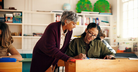 Education, teacher and people in school at desk, help and communication in problem solving. Discussion, advice and mentor in classroom with stationary, engagement or assistance for curriculum support