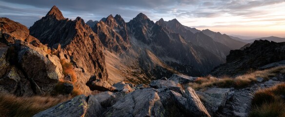Obraz premium A rocky mountain with a cloudy sky in the background