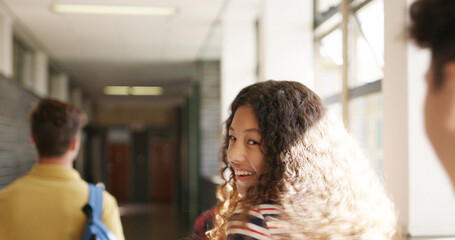 Walking, smile and hallway with girl in high school for education, future and gen z students. Learning, happiness and scholarship with group of teenagers on campus for knowledge, friends and academy