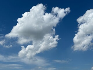 White fluffy clouds on blue sky