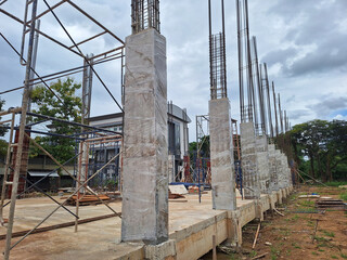 Construction site of a building with an earthquake-resistant structure, with several concrete...