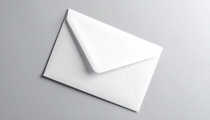 Minimalist still life of a blank white paper envelope with a closed flap, ready for sending mail or correspondence on a gray background