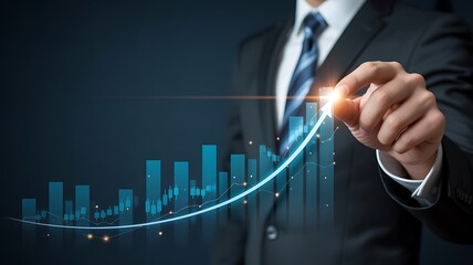 Businessman gesturing towards a glowing blue stock market growth chart on a digital display