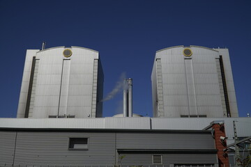 Coal-fired power plant in the afternoon sun. An old technology that is partly responsible for global warming. Hannover Stöcken, Lower Saxony, Germany.