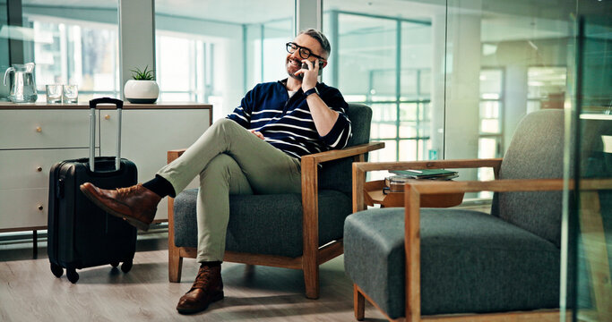 Phone call, travel and man in airport lounge for professional contact, flight schedule and luggage. Communication, layover update and business trip with mature person in vip lobby with suitcase
