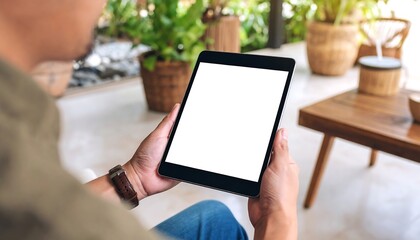 Person holding a tablet outdoors
