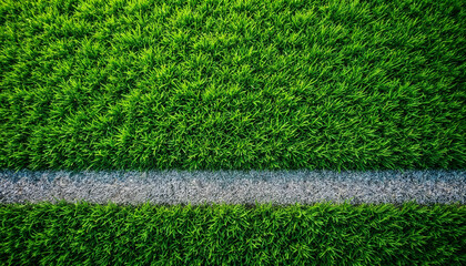 Overhead close-up of lush green football field grass with striped pattern.