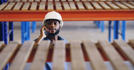 Black man, phone call and contact at storage warehouse, inspection and report by shelf at plant....