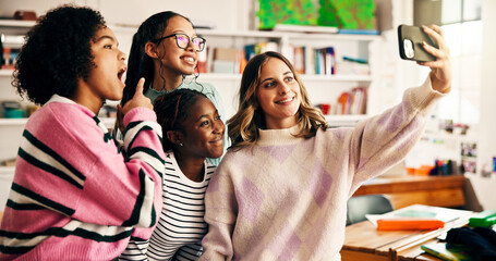 Happy girls, students and group selfie in classroom for photography, picture or memory together. Female people, teenager or friends with smile for capture moment, social media or post in school
