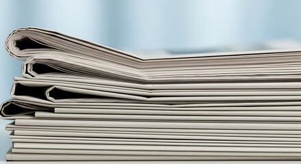 A neat stack of freshly folded newspapers, representing the daily flow of essential news and information, providing readers with updates on current events and global affairs