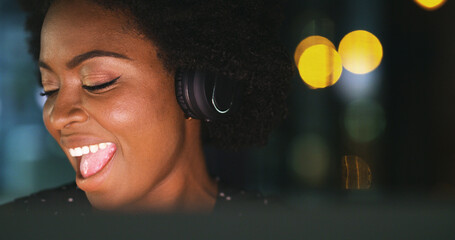 Woman, headphones and singing at night in office with bokeh, music and computer at media company....