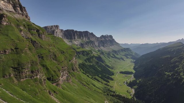 aerial view of urnerboden valley surrounded by cliffs and alpine meadows klausenpass uri switzerland