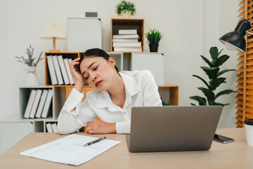 bored woman working with laptop computer at home office