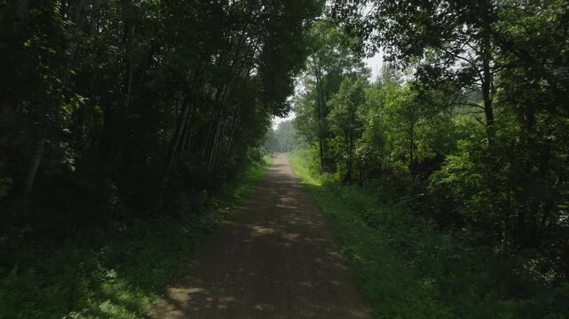 Flying Down The Gandy Dancer State Trail At St. Croix Falls In Wisconsin, United States. Aerial Drone Shot