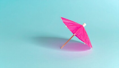 Pink umbrella on a bright blue background