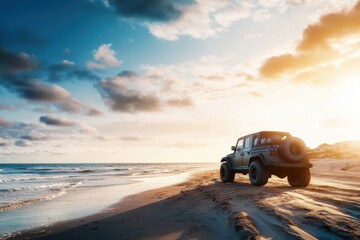 Off-road vehicle parked on sandy beach during sunset with cloudy sky