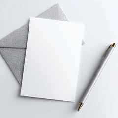 Elegant Silver Notebook and Pen Set on Minimalistic White Background for Stylish Writing
