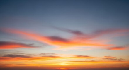 Obraz premium Vibrant Sunset Sky with Fiery Orange and Pink Clouds