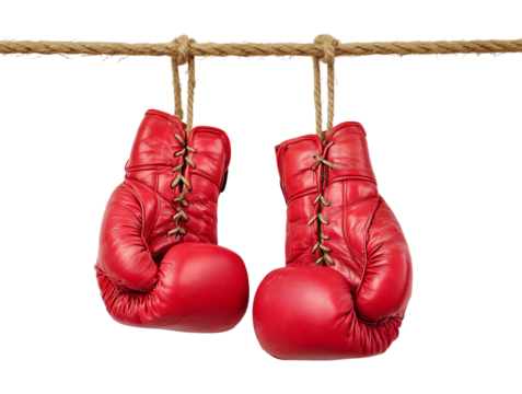 A pair of vibrant red boxing gloves are suspended from a coarse rope isolated on a transparent background