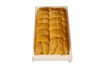 Fresh sea urchin roe in wooden tray