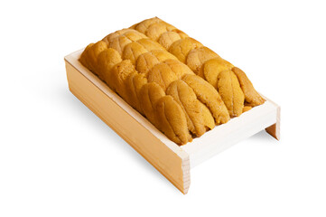 Close-up of fresh sea urchin roe neatly arranged in a wooden tray, commonly used in sushi and Japanese cuisine 