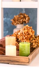 Autumnal candles on a tray