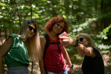Women taking selfie in forest