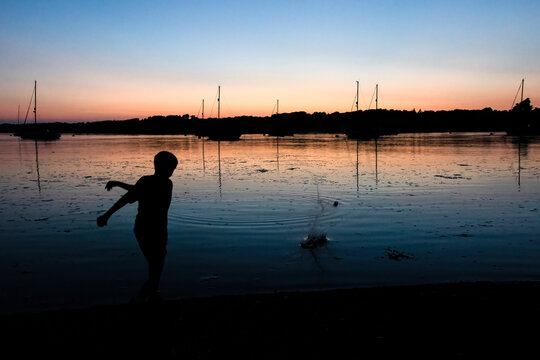 Skimming Stones at Sunset