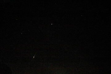 arade of planets in the night sky. Kiss of Venus and Jupiter