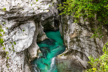 aerial view of hidden turquoise river flowing in rocky canyon. crystal clear turquoise river. clean transparent flowing water. white rocky